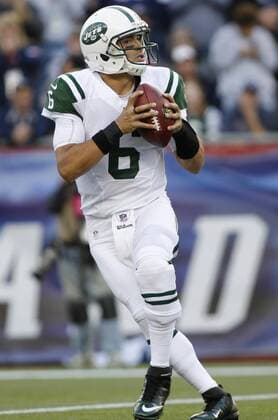 New York Jets quarterback Mark Sanchez rolls out for a pass in the first quarter against the New England Patriots at Gillette Stadium in Foxboro, Massachusetts on October 21, 2012.  BOS2012102105
