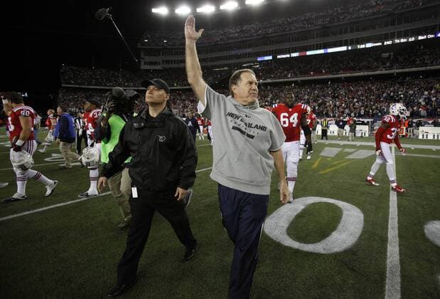 New England Patriots head coach Bill Belichick throws his arm in the air after the Patriots defeated the New York Jets 29-26 in overtime at Gillette Stadium in Foxboro, Massachusetts on October 21, 2012.  BOS2012102107