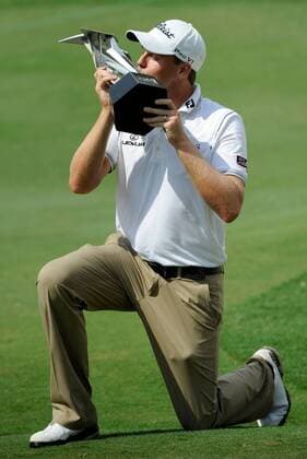 Oct. 28, 2012 - Kuala Lumpur, Malaysia - NICK WATNEY of the U.S. kisses the winners trophy after winning the CIMB Classic golf tournament at the Mines Resort and Golf Club in Kuala Lumpur. Golf 2012 - CIMB Classic - Day 4 - ZUMAz93