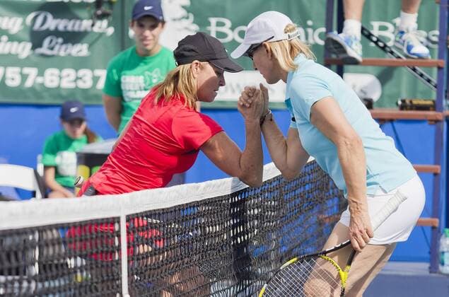 Oct. 27, 2012 - Delray Beach, Florida, U.S. - CHRIS EVERT and MARTINA NAVRATILOVA arm wrestle at the net during the 2012 at the 2012 ChrisxEvert RaymondxJames Pro-Celebrity Tennis Classic. Chris Evert Pro-Celebrity Classic 2012 - ZUMAmu2