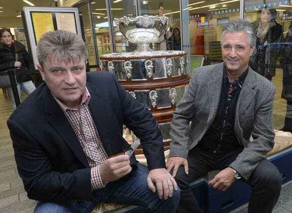 Captain of Czech tennis player Jaroslav Navratil and president of the Czech Tennis Association Ivo Kaderka are seen in front of the Davis Cup trophy at the Main Train Station in Prague where they announced the nomination for Davis Cup final against Spain. Davis Cup final will be played in Prague from 16th to 18th November. Jaroslav Navratil and Ivo Kaderka are seen in Prague, Czech Republic, November 6, 2012. (CTKxPhoto MichalxDolezal) CTKPhotoP201211060410601  dol 001
