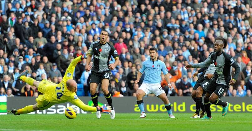 Sergio Kun Aguero of Manchester City scores the equalising goal past a diving Brad Friedel of Tottenham - Barclays Premier League - Manchester City vs Tottenham - Etihad Stadium - Manchester - 11 11 12 - Picture Simon Bellis Sportimage EDITORIAL USE ONLY. No use with unauthorised audio, video, data, fixture lists, club league logos or live services. Online in-match use limited to 120 images, no video emulation. No use in betting, games or single club league player publications.