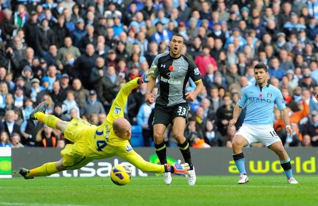 Sergio Kun Aguero of Manchester City scores the equalising goal past a diving Brad Friedel of Tottenham - Barclays Premier League - Manchester City vs Tottenham - Etihad Stadium - Manchester - 11 11 12 - Picture Simon Bellis Sportimage EDITORIAL USE ONLY. No use with unauthorised audio, video, data, fixture lists, club league logos or live services. Online in-match use limited to 120 images, no video emulation. No use in betting, games or single club league player publications.