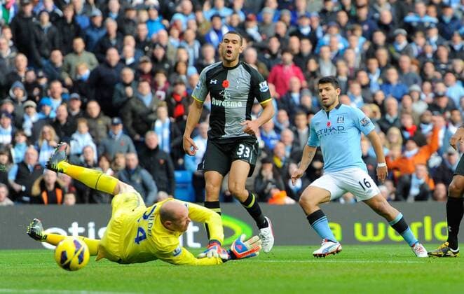 Sergio Kun Aguero of Manchester City scores the equalising goal past a diving Brad Friedel of Tottenham - Barclays Premier League - Manchester City vs Tottenham - Etihad Stadium - Manchester - 11 11 12 - Picture Simon Bellis Sportimage EDITORIAL USE ONLY. No use with unauthorised audio, video, data, fixture lists, club league logos or live services. Online in-match use limited to 120 images, no video emulation. No use in betting, games or single club league player publications.