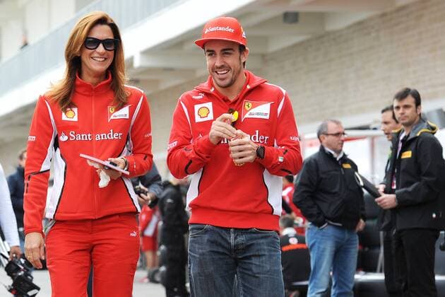 FERRARI SPANISH DRIVER FERNANDO ALONSO ON THE WAY TO PRESS CONFERENCE WITH PRESS OFFICER ROBERTA FORMULA 1 - GP of USA - Circuit of the Americas - Austin - 16 11 2012 BernardAsset Panoramic 