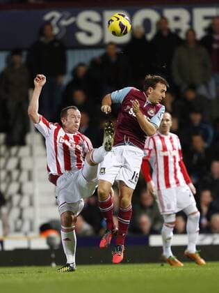 West Ham s Mark Noble tussles with Stoke s Charlie Adam.. West Ham United - Stoke City. Premier League- Upton Park, London- 19 11 12 - xDavidxKleinxSportimagex EDITORIAL USE ONLY. No use with unauthorised audio, video, data, fixture lists, club league logos or live services. Online in-match use limited to 120 images, no video emulation. No use in betting, games or single club league player publications.