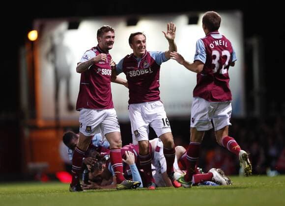 West Ham s George McCartney and Mark Noble celebrates their sides opening goal.. West Ham United - Stoke City. Premier League- Upton Park, London- 19 11 12 - xDavidxKleinxSportimagex EDITORIAL USE ONLY. No use with unauthorised audio, video, data, fixture lists, club league logos or live services. Online in-match use limited to 120 images, no video emulation. No use in betting, games or single club league player publications.