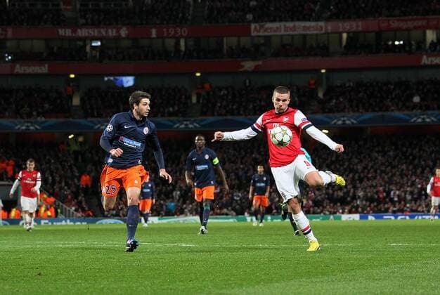 Arsenal s Lukas Podolski scoring his sides second goal. FC Arsenal London v HSC Montpellier -Champions League- Emirates Stadium, London- 21 11 12 - Picture DavidxKlein Sportimage EDITORIAL USE ONLY. No use with unauthorised audio, video, data, fixture lists, club league logos or live services. Online in-match use limited to 120 images, no video emulation. No use in betting, games or single club league player publications.
