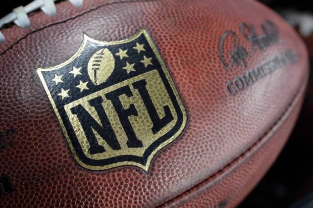 November 22, 2012: NFL American Football Herren USA logo on the football during the Thanksgiving game between the Washington Redskins and the Dallas Cowboys at Cowboys Stadium in Arlington, Texas. Washington Redskins wins against Dallas Cowboys, 38-31. NFL American Football Herren USA NOV 22 Redskins at Cowboys Icon1211222196 EDITORIAL USE ONLY