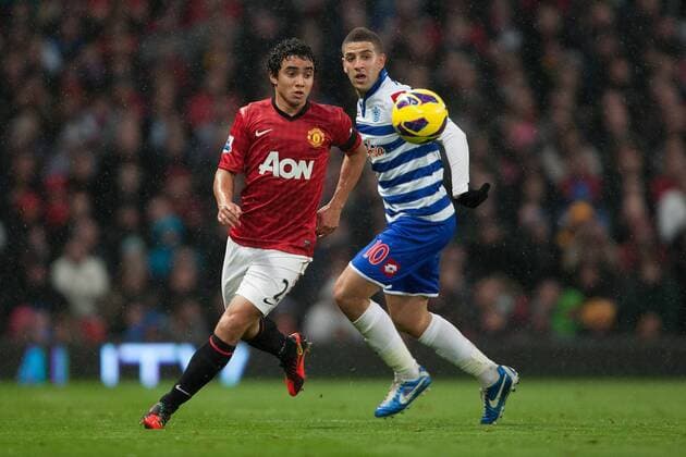 Football - 2012 2013 Premier League - Manchester United vs. (QPR) Queens Park Rangers (QPR) Rafael of Manchester United and QPR s Adel Taarabt at Old Trafford 