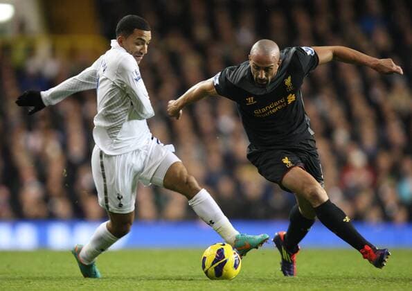 28.11.2012. North London, England. Aaron Lennon of Tottenham Hotspur and Jose Enrique of Liverpool in action during the Premier League match between Tottenham Hotspur and Liverpool from White Hart Lane, London xKieranxGalvinx  ActionPlus11351943