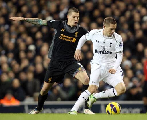 28.11.2012. North London, England. Gylfi Sigurdsson of Tottenham Hotspur and Daniel Agger of Liverpool in action during the Premier League match between Tottenham Hotspur and Liverpool from White Hart Lane, London xKieranxGalvinx  ActionPlus11351967