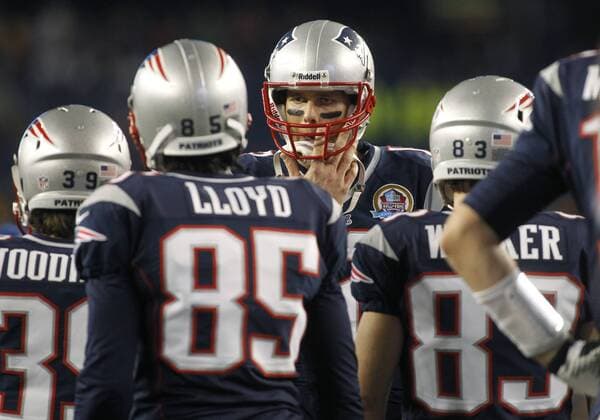 New England Patriots quarterback Tom Brady (12) calls a play while warming up before the game against the Houston Texans at Gillette Stadium in Foxborough, Massachusetts on December 10, 2012.  BOS2012121002