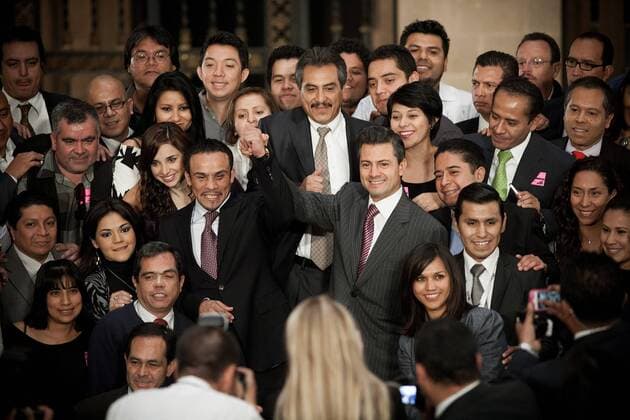 Mexican President Enrique Pena Nieto (R, center) and Mexican boxer Juan Manuel Marquez (L, center) cheer during a ceremony at the National Palace, in Mexico City, capital of Mexico, on Dec. 14, 2012. The welterweight champion Juan Manuel Marquez presented Pena Nieto the gloves he used on the match he won against Filipino boxer Manny Pacquiao as a gift. (Xinhua Pedro Mera) (ce) MEXICO-MEXICO CITY-BOXING-PENA NIETO-MARQUEZ 
