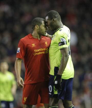 Glen Johnson of Liverpool (left) has an exchange of views with Villa s Christian Benteke.Barclays Premiership - FC Liverpool vs Aston Villa - Anfield - Liverpool - 15 12 12 - EDITORIAL USE ONLY. No use with unauthorised audio, video, data, fixture lists, club league logos or live services. Online in-match use limited to 120 images, no video emulation. No use in betting, games or single club league player publications.