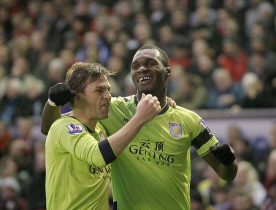 Brett Holman of Aston Villa (left) congratulates goalscorer Christian Benteke.Barclays Premiership - FC Liverpool vs Aston Villa - Anfield - Liverpool - 15 12 12 - EDITORIAL USE ONLY. No use with unauthorised audio, video, data, fixture lists, club league logos or live services. Online in-match use limited to 120 images, no video emulation. No use in betting, games or single club league player publications.