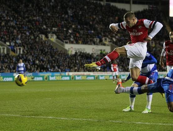 Arsenal s Lukas Podolski scoring his sides opening goal Reading v Arsenal - Premier League - Madejski Stadium, Reading- 17 12 12 - Picture David Klein Sportimage EDITORIAL USE ONLY. No use with unauthorised audio, video, data, fixture lists, club league logos or live services. Online in-match use limited to 120 images, no video emulation. No use in betting, games or single club league player publications.