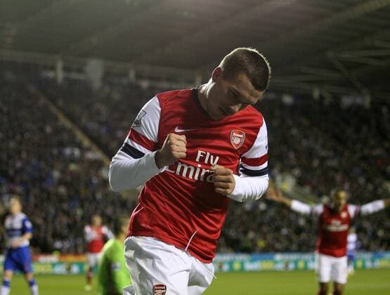 Arsenal s Lukas Podolski celebrates scoring his sides opening goal Reading v Arsenal - Premier League - Madejski Stadium, Reading- 17 12 12 - Picture David Klein Sportimage EDITORIAL USE ONLY. No use with unauthorised audio, video, data, fixture lists, club league logos or live services. Online in-match use limited to 120 images, no video emulation. No use in betting, games or single club league player publications.