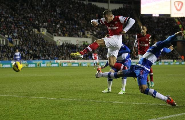 Arsenal s Lukas Podolski scoring his sides opening goal Reading v Arsenal - Premier League - Madejski Stadium, Reading- 17 12 12 - Picture David Klein Sportimage EDITORIAL USE ONLY. No use with unauthorised audio, video, data, fixture lists, club league logos or live services. Online in-match use limited to 120 images, no video emulation. No use in betting, games or single club league player publications.