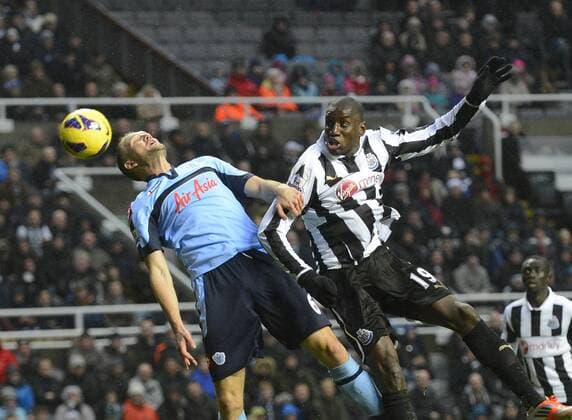 Newcastle United s Demba Ba (R) is beaten to the ball by Clint Hill of QPR Queens Park Rangers (QPR) - Barclays Premier League - Newcastle United vs QPR Queens Park Rangers (QPR) - St. James Park - Newcastle United - 22 12 12 - Picture Richard Lee Sportimage EDITORIAL USE ONLY. No use with unauthorised audio, video, data, fixture lists, club league logos or live services. Online in-match use limited to 120 images, no video emulation. No use in betting, games or single club league player publications.