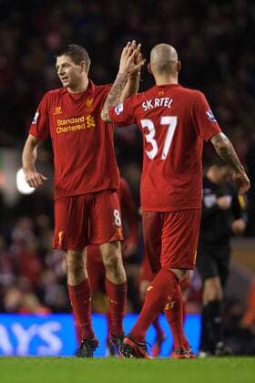 Football - 2012 2013 Premier League - Liverpool FC vs. Fulham FC - Martin Skrtel of Liverpool FC congratulates Steven Gerrard on his goal at Anfield 