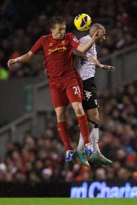 Football - 2012 2013 Premier League - Liverpool FC vs. Fulham FC - Lucas of Liverpool FC and Ashkan Dejagah of Fulham FC at Anfield 