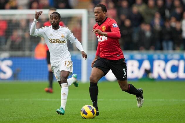 Football - 2012 2013 Premier League - Swansea vs. Manchester United Swansea s Nathan Dyer and Patrice Evra of Manchester United at the Liberty Stadium 