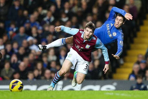 Football - 2012 2013 Premier League - Chelsea vs. Aston Villa Chelsea s Eden Hazard is fouled by Aston Villa s Chris Herd at Stamford Bridge, London 
