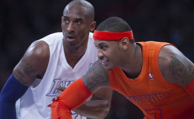 LOS ANGELES, (Xinhua) -- Los Angeles Lakers Kobe Bryant (L) and New York Knicks Carmelo Anthony react during the NBA Basketball Herren USA basketball game in Los Angeles, the United States, Dec. 25, 2012. Lakers won 100-94. (Xinhua Yang Lei) U.S.-LOS ANGELES-NBA-LAKERS VS KNICKS 