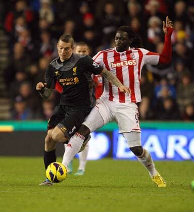 Martin Skrtel of Liverpool battles with Kenwyene Jones- Barclays Premier League - Stoke City vs Liverpool - Britannia Stadium - Stoke on Trent - 26th December 2012 - Credit Paul Bradbury Sportimage EDITORIAL USE ONLY. No use with unauthorised audio, video, data, fixture lists, club league logos or live services. Online in-match use limited to 120 images, no video emulation. No use in betting, games or single club league player publications.