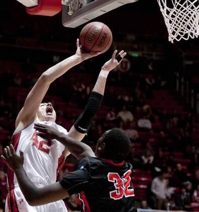 Dec. 21, 2012 - Salt Lake City, Utah, U.S - Utah Utes center JASON WASHBURN (42) puts up a jump shot with pressure from CSU Northridge Matadors center BRANDON PERRY (32) during their game at the Jon M. Huntsman Center in Salt Lake City, UT on Friday, December 21, 2012. CSU Northridge came back from 21 points down at halftime to defeat Utah 76-71. NCAA College League USA Basketball 2012 - CSU Northridge defeats Utah 76-71  - ZUMAm10