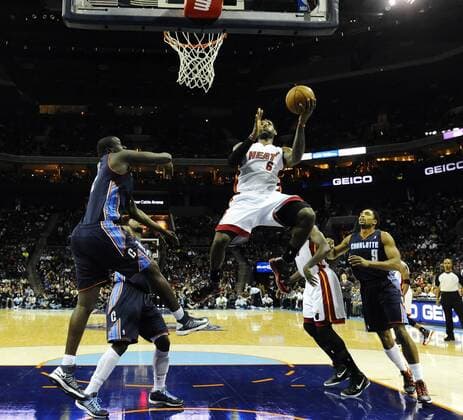 Dec. 26, 2012 - Charlotte, NC, USA - The Miami Heat s LeBron James (6) drives in between the Charlotte Bobcats DeSagana Diop (2) and Gerald Henderson (9) during the first half at Time Warner Cable Arena in Charlotte, North Carolina, on Wednesday, December 26, 2012. Miami at Charlotte - ZUMAm67