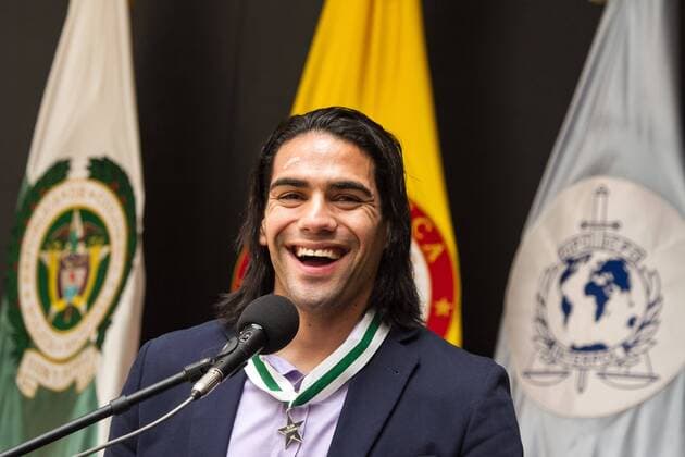 BOGOTA, Dec. 26, 2012 - Colombian soccer player Radamel Falcao Garcia smiles during an awarding ceremony in Bogota, capital of Colombia, on Dec. 26, 2012. Falcao Garcia received his Civic Award from Colombia s National Police in the ceremony Wednesday. (Xinhua Jhon Paz) (da) (sp) COLOMBIA-BOGOTA-GARCIA-AWARD 