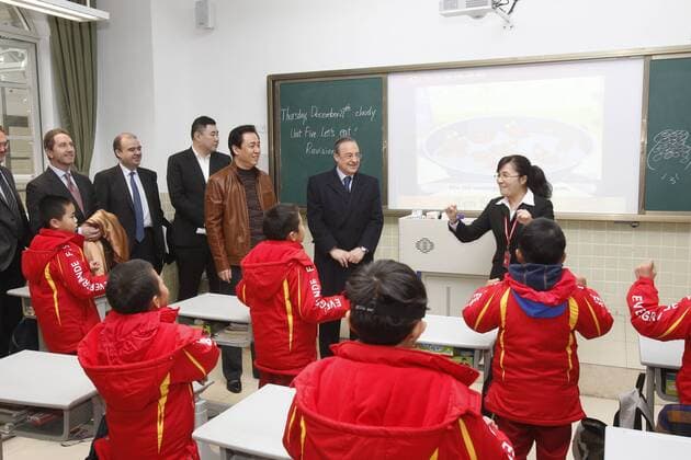 QINGYUAN, CHINA - DECEMBER 27: (CHINA OUT) Guangzhou Evergrande owner Xu Jiayin (2nd L) and Real Madrid president Florentino Perez visit Evergrande-Real Madrid Football School on December 27, 2012 in Qingyuan, Guangdong Province of China. Florentino Perez and his delegation are on a multi-day visit to Guangzhou Evergrande FC, who has a cooperation agreement with Real Madrid that has led to the creation of a football school in Qingyuan.  CFP434892245 