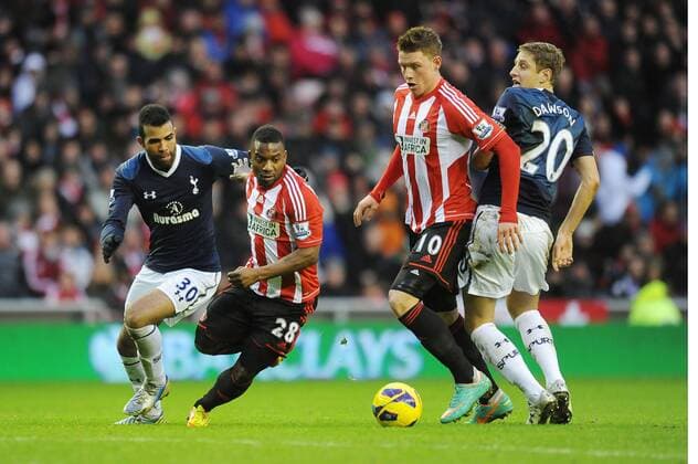 Football - 2012 2013 Premier League - Sunderland vs. Tottenham Hotspur Stephane Sessegnon (Sunderland) goes past Sandro (Spurs) at the Stadium of Light 