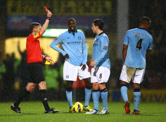 Football - 2012 2013 Premier League - Norwich vs. Manchester City Referee Mike Jones shows Samir Nasri of Manchester City a red card after an alleged headbutt on Norwich City s Sebastien Bassong at Carrow Road, Norwich  4557-1
