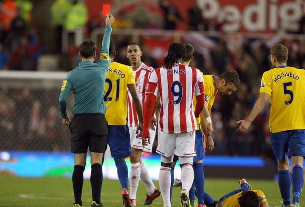 Stoke City s Steven Nzoni is sent off by referee Mark Clattenburg after a late challenge on Southampton s Jack Cork- Barclays Premier League - Stoke City vs Southampton - Britannia Stadium - Stoke on Trent - 29th December 2012 - Credit Paul Bradbury Sportimage EDITORIAL USE ONLY. No use with unauthorised audio, video, data, fixture lists, club league logos or live services. Online in-match use limited to 120 images, no video emulation. No use in betting, games or single club league player publications.