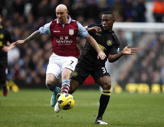 Football- Premier League-Aston Villa vs. Wigan Athletic- Aston Villa s Stephen Ireland and Wigan s Emerson Boyce battle at Villa Park 
