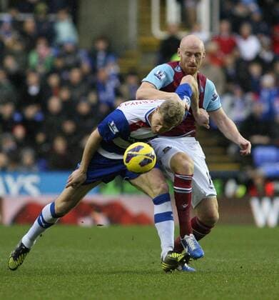 Football - 2012 2013 Premier League - Reading vs West Ham United Readings Pavel Pogrebnyak and James Collins of West Ham United battle for the ball at the Madejski Stadium Reading 