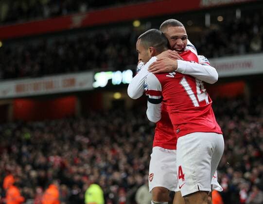 Arsenal s Theo Walcott celebrates scoring his sides seventh goal with Kieran Gibbs..- Arsenal v Newcastle United - Barclays Premier League - the Emirates Stadium, London- 29 12 12 - Picture David Klein Sportimage EDITORIAL USE ONLY. No use with unauthorised audio, video, data, fixture lists, club league logos or live services. Online in-match use limited to 120 images, no video emulation. No use in betting, games or single club league player publications.