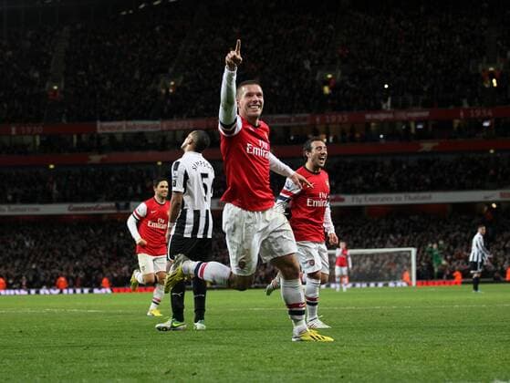 Arsenal s Lukas Podolski celebrates scoring his sides third goal..- Arsenal v Newcastle United - Barclays Premier League - the Emirates Stadium, London- 29 12 12 - Picture David Klein Sportimage EDITORIAL USE ONLY. No use with unauthorised audio, video, data, fixture lists, club league logos or live services. Online in-match use limited to 120 images, no video emulation. No use in betting, games or single club league player publications.
