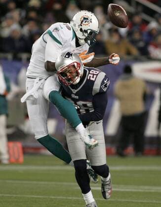 New England Patriots safety Steve Gregory breaks up a pass intended for Miami Dolphins wide receiver Armon Binns (19) in the fourth quarter at Gillette Stadium in Foxborough, Massachusetts on December 30, 2012. The Patriots defeated the Dolphins 28-0.  BOS2012123011