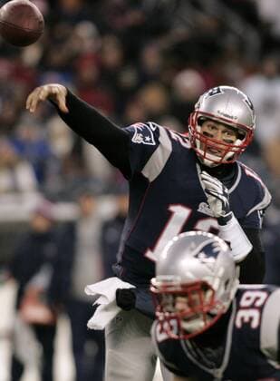 New England Patriots quarterback Tom Brady (12) throws a pass in the first quarter against the Miami Dolphins at Gillette Stadium in Foxborough, Massachusetts on December 30, 2012.  BOS2012123002