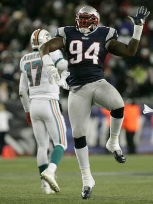 New England Patriots defensive lineman Justin Francis (94) celebrates after sacking Miami Dolphins quarterback Ryan Tannehill (17) for a three-yard loss in the fourth quarter at Gillette Stadium in Foxborough, Massachusetts on December 30, 2012. The Patriots defeated the Dolphins 28-0.  BOS2012123010