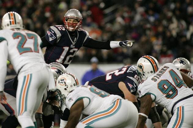 New England Patriots quarterback calls an audible at the line of scrimmage in the second quarter against the Miami Dolphins at Gillette Stadium in Foxborough, Massachusetts on December 30, 2012. The Patriots defeated the Dolphins 28-0.  BOS2012123015