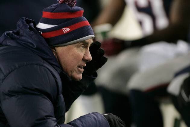 New England Patriots head coach Bill Belichick talks to his defense in the fourth quarter against the Miami Dolphins at Gillette Stadium in Foxborough, Massachusetts on December 30, 2012. The Patriots defeated the Dolphins 28-0.  BOS2012123017