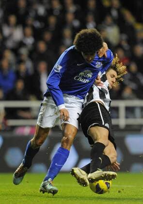 Newcastle United s Fabricio Coloccini (L) gets to grips with Marouane Fellaini of Everton - Barclays Premier League - Newcastle United vs Everton - St. James Park - Newcastle - 02 01 13 - Picture Richard Lee Sportimage EDITORIAL USE ONLY. No use with unauthorised audio, video, data, fixture lists, club league logos or live services. Online in-match use limited to 120 images, no video emulation. No use in betting, games or single club league player publications.
