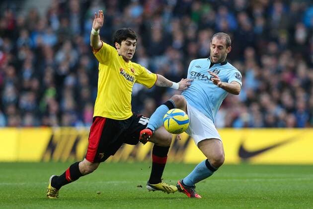 Football - 2012 2013 FA Cup - Third Round: Manchester City vs. Watford FC Watford s Fernando Forestieri and Manchester City s Pablo Zabaleta at Etihad Stadium, Manchester 