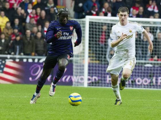 Football - 2012 2013 FA Cup - Third Round: Swansea vs. Arsenal barcaray sagna goes on the outside of ben davies 