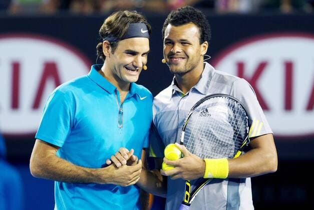 TENNIS - Australian Open 2012 MELBOURNE,AUSTRALIEN,12.JAN.13 - TENNIS - Grand Slam, Australian Open, Kids Tennis Day. Bild zeigt Roger Federer (SUI) und Jo-Wilfried Tsonga (FRA). 